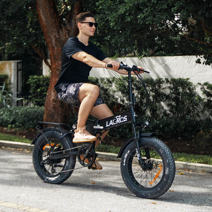 Riding Pinecone electric bike on a city street 