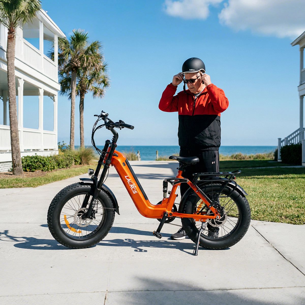 Rider preparing to use an orange Lacros Cyclone 2026 electric bike